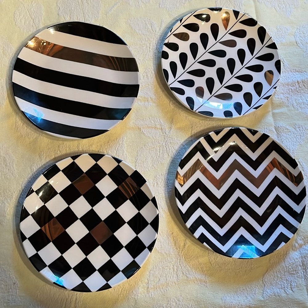 Set of 4 PAI dessert plates in different patterns of black, white & gold. 6”.